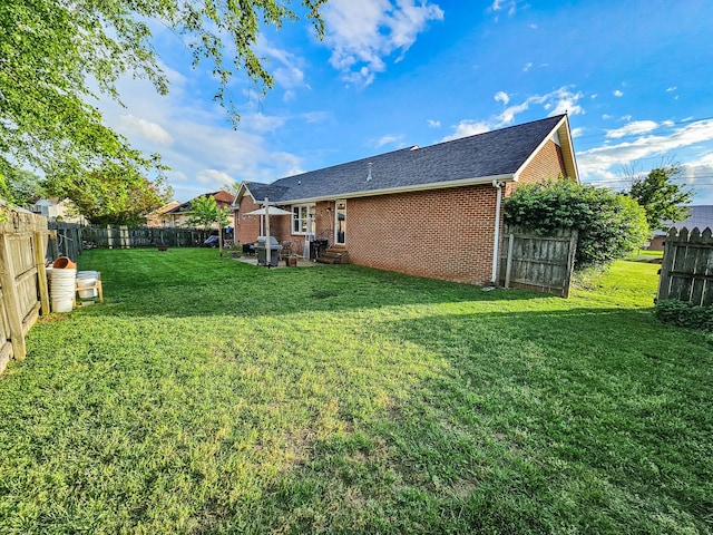 103 Hillcrest Dr, Tullahoma, TN 37388 - back of house with entry steps, brick siding, and roof with shingles
