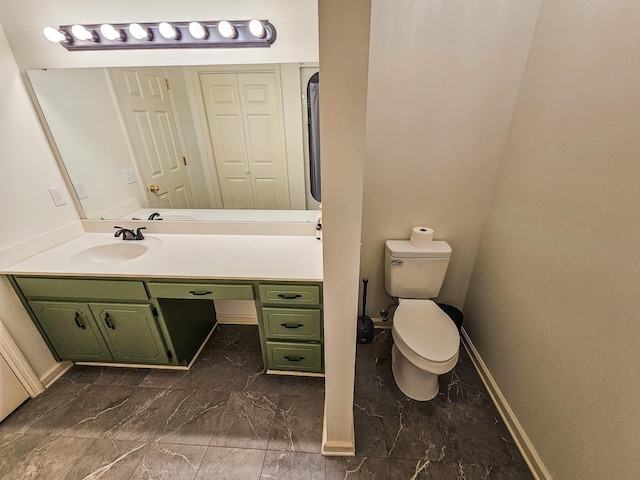103 Hillcrest Dr, Tullahoma, TN 37388 - bathroom featuring vanity, toilet, baseboards, and marble finish flooring