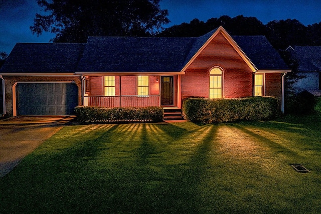 103 Hillcrest Dr, Tullahoma, TN 37388 - view of front of home with a garage, brick siding, a front lawn, and driveway