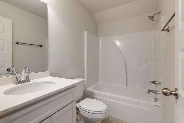 bathroom with vanity, bathtub / shower combination, and toilet