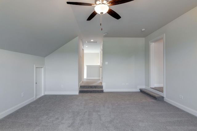 additional living space with carpet flooring, a ceiling fan, baseboards, and visible vents
