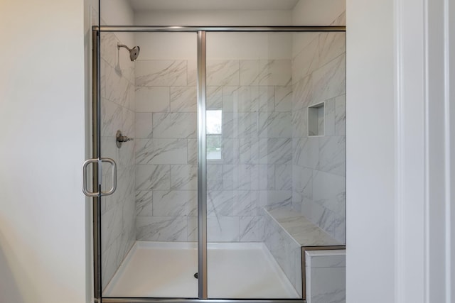 bathroom with a shower stall