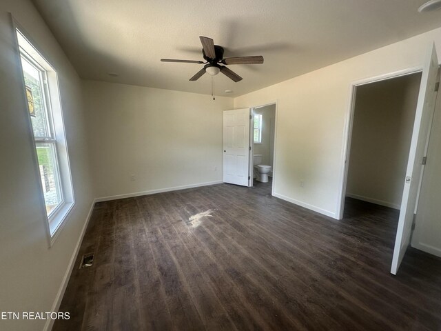 2765 Banner Springs Rd, Jamestown, TN 38556 - unfurnished room featuring dark wood-style floors, baseboards, plenty of natural light, and ceiling fan