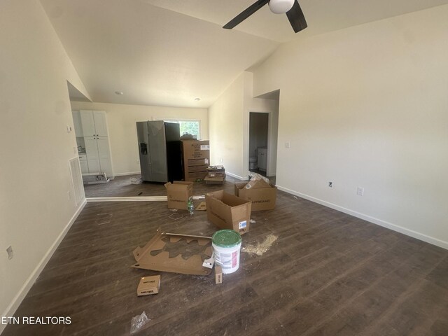 2765 Banner Springs Rd, Jamestown, TN 38556 - unfurnished living room featuring vaulted ceiling, baseboards, ceiling fan, and wood finished floors