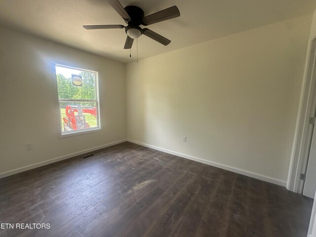 2765 Banner Springs Rd, Jamestown, TN 38556 - unfurnished room with ceiling fan, baseboards, and dark wood-type flooring