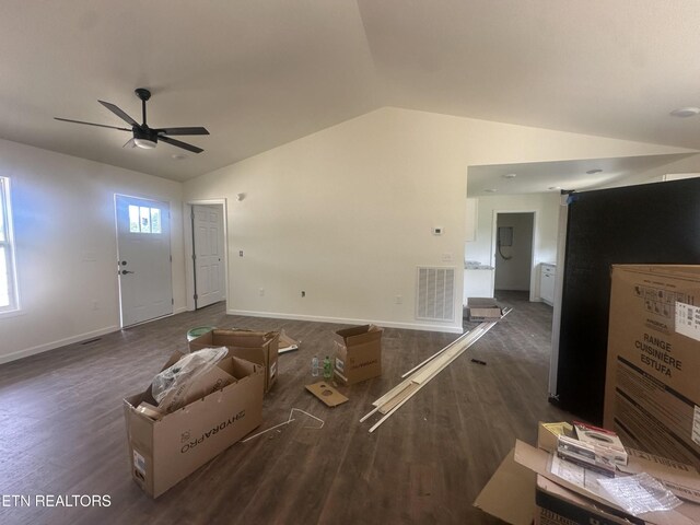 2765 Banner Springs Rd, Jamestown, TN 38556 - unfurnished living room featuring lofted ceiling, dark wood-type flooring, a ceiling fan, and baseboards