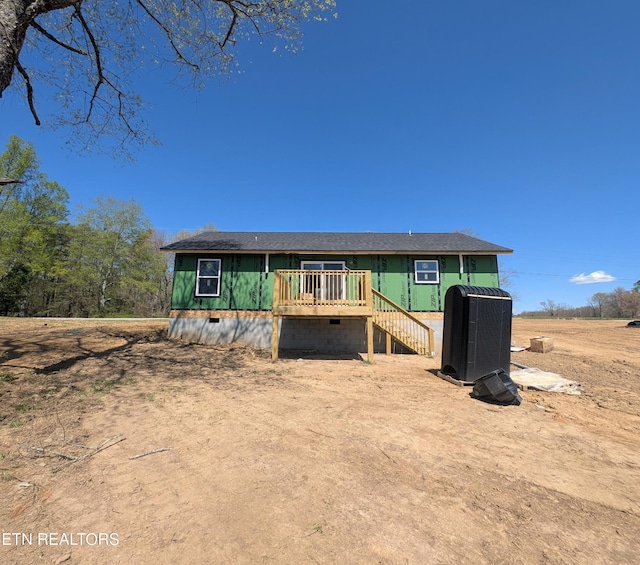view of front facade with a wooden deck, stairs, central AC unit, and crawl space