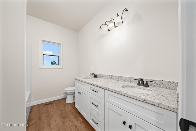 552 Vista View Pkwy, Jamestown, TN 38556 - full bath with toilet, baseboards, a sink, and wood finished floors