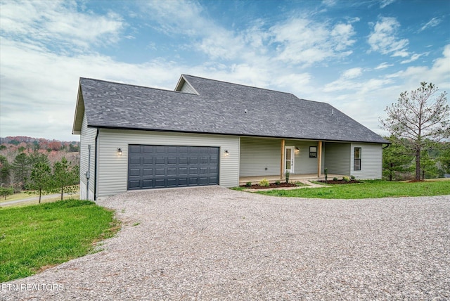 552 Vista View Pkwy, Jamestown, TN 38556 - view of front of house featuring a garage, roof with shingles, and driveway