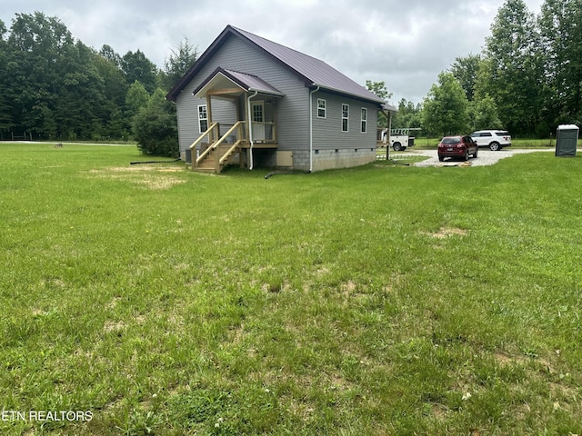 1173 Terry Ln, Jamestown, TN 38556 - view of property exterior with a metal roof and a lawn