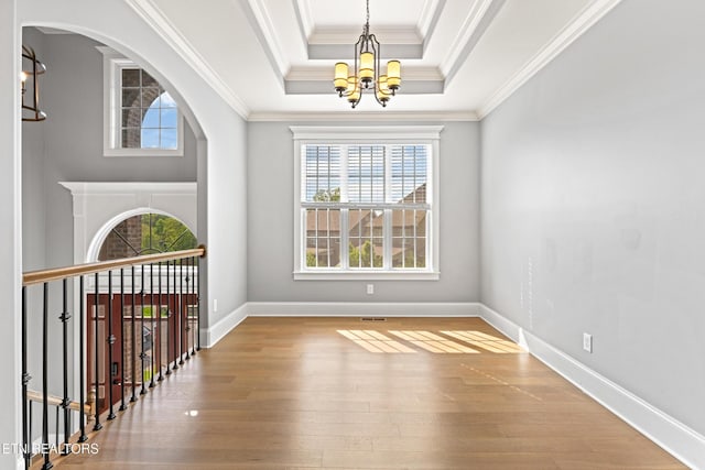 8508 Flowering Peach Ln, Knoxville, TN 37923 - foyer with a raised ceiling, wood finished floors, a notable chandelier, and a healthy amount of sunlight