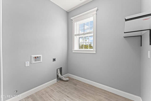 8508 Flowering Peach Ln, Knoxville, TN 37923 - laundry room with laundry area, light wood-style floors, hookup for a washing machine, baseboards, and electric dryer hookup