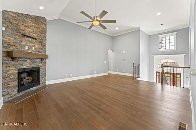 8508 Flowering Peach Ln, Knoxville, TN 37923 - unfurnished living room featuring visible vents, ceiling fan, wood finished floors, and a fireplace