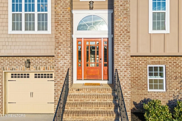 8508 Flowering Peach Ln, Knoxville, TN 37923 - view of exterior entry with brick siding and an attached garage