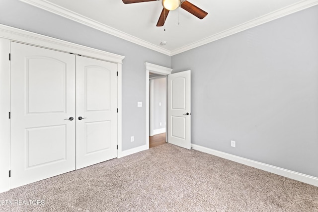 8508 Flowering Peach Ln, Knoxville, TN 37923 - unfurnished bedroom featuring carpet, a ceiling fan, baseboards, ornamental molding, and a closet