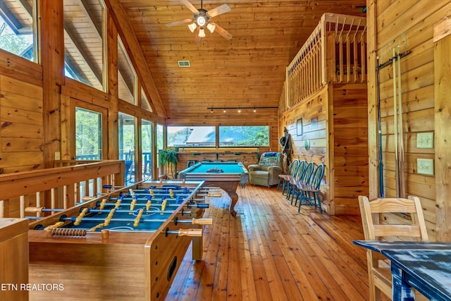rec room with high vaulted ceiling, plenty of natural light, wood-type flooring, and billiards