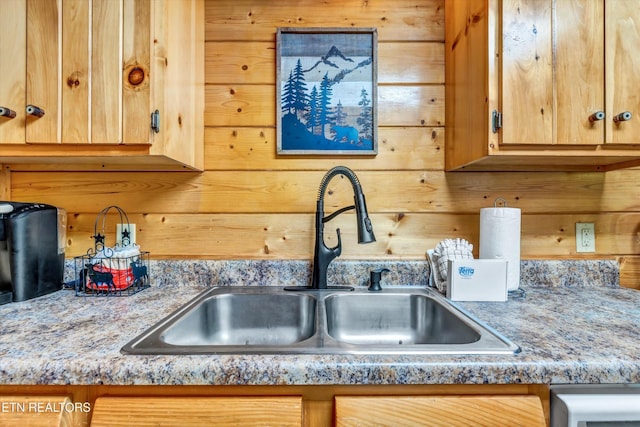 kitchen featuring a sink and light countertops