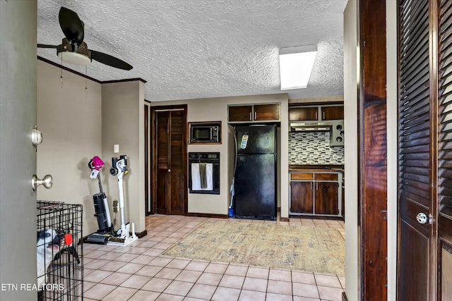 2220 Thorn Grove Pike, Knoxville, TN 37914 - kitchen featuring light tile patterned flooring, ceiling fan, dark brown cabinetry, tasteful backsplash, and black appliances