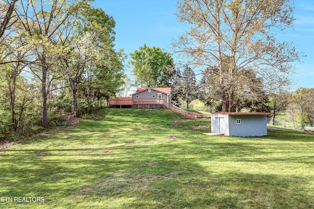 2220 Thorn Grove Pike, Knoxville, TN 37914 - view of yard with an outdoor structure, a shed, and a deck