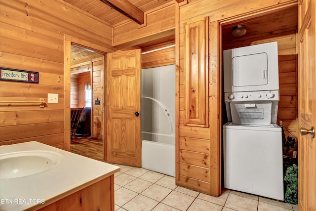415 Silver Maple Ln, Gatlinburg, TN 37738 - full bathroom featuring stacked washing maching and dryer, wood ceiling, wooden walls, and beam ceiling