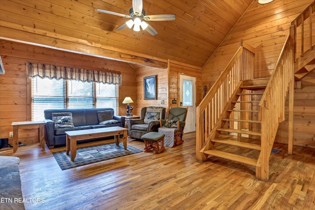 415 Silver Maple Ln, Gatlinburg, TN 37738 - living area with ceiling fan, wood finished floors, lofted ceiling, wooden walls, and stairs