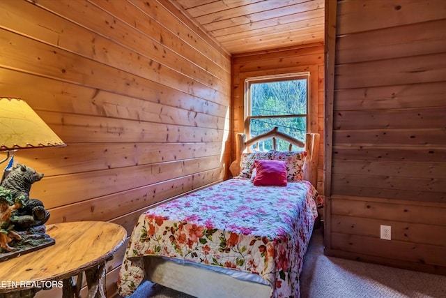 415 Silver Maple Ln, Gatlinburg, TN 37738 - carpeted bedroom featuring wooden walls and wooden ceiling