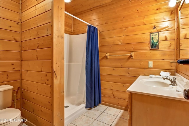 415 Silver Maple Ln, Gatlinburg, TN 37738 - bathroom with wooden walls, tile patterned flooring, vanity, toilet, and a stall shower