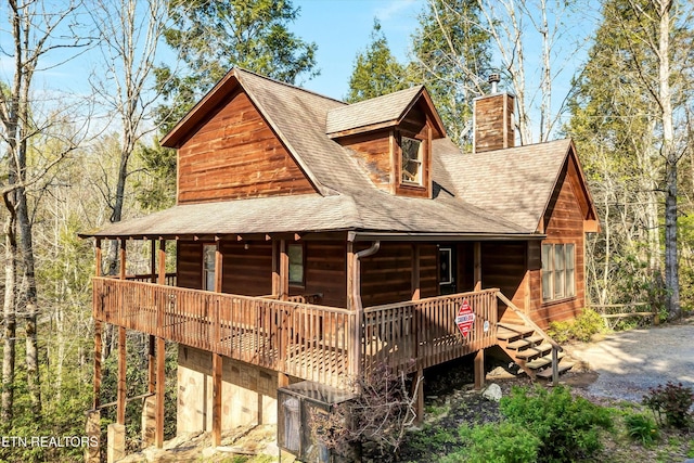415 Silver Maple Ln, Gatlinburg, TN 37738 - rear view of house with roof with shingles, a wooden deck, and a chimney