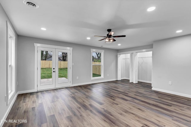 unfurnished living room featuring dark wood finished floors, french doors, recessed lighting, a ceiling fan, and visible vents