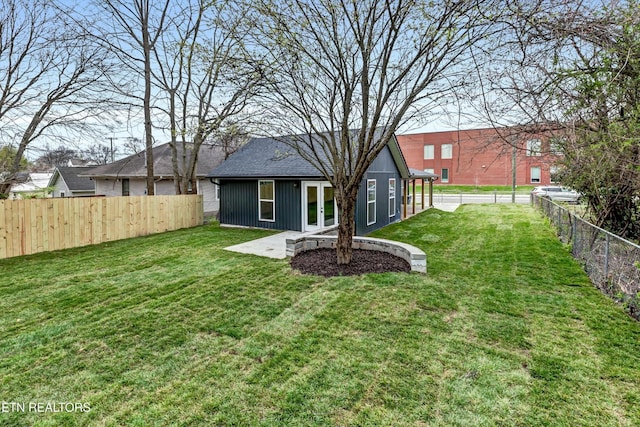 view of yard featuring a patio and a fenced backyard