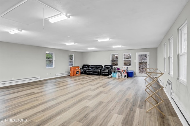 1606 Sexton Ln, Knoxville, TN 37932 - game room with wood finished floors, a baseboard radiator, a baseboard heating unit, and attic access