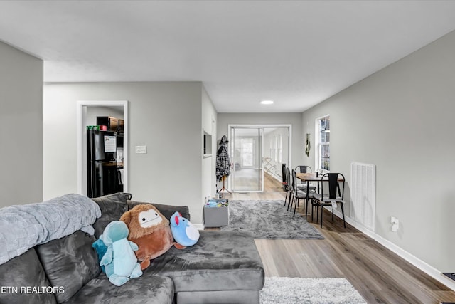 1606 Sexton Ln, Knoxville, TN 37932 - living area featuring baseboards, wood finished floors, and visible vents