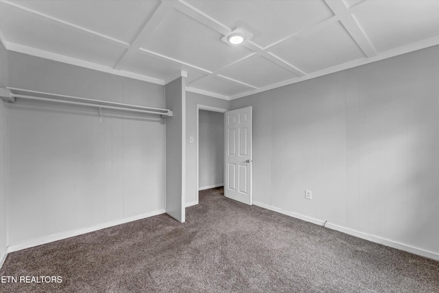 unfurnished bedroom featuring carpet floors and baseboards