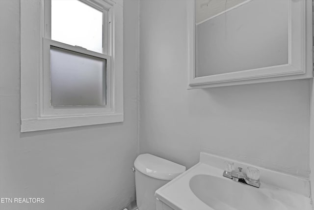 half bath with vanity and toilet
