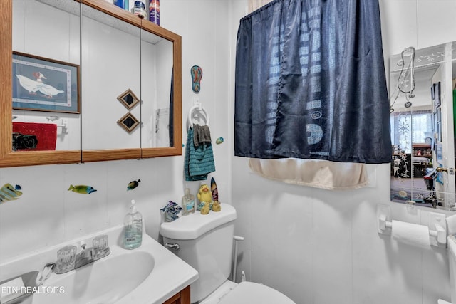 half bath with vanity and toilet