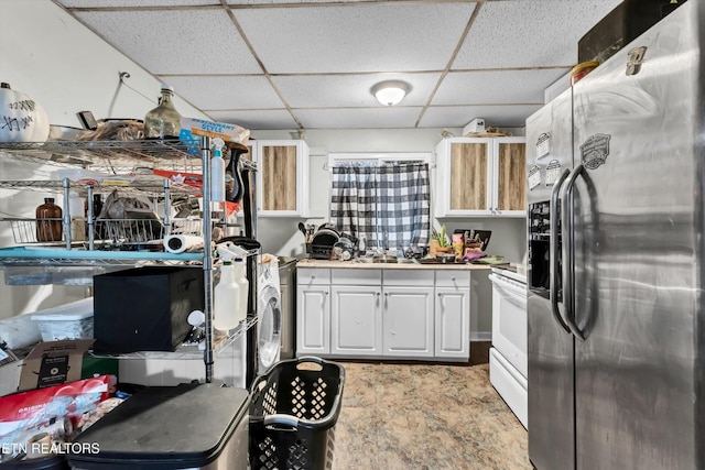 565567 W Outer Dr, Oak Ridge, TN 37830 - kitchen featuring white cabinets, electric range, a drop ceiling, and stainless steel fridge
