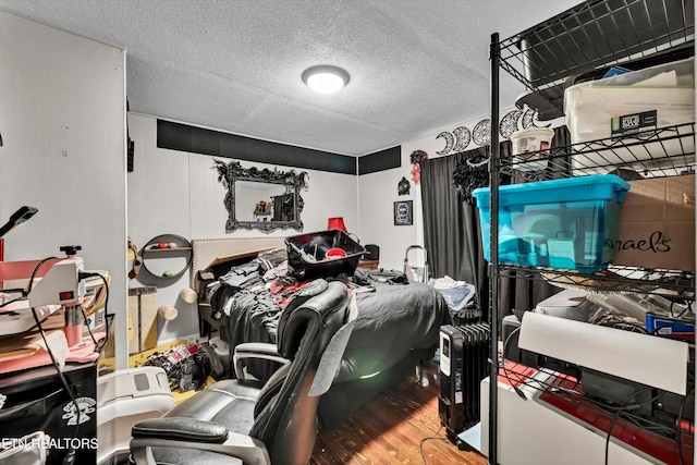 565567 W Outer Dr, Oak Ridge, TN 37830 - bedroom with a textured ceiling and wood finished floors