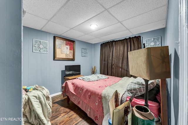 565567 W Outer Dr, Oak Ridge, TN 37830 - bedroom with baseboards, wood finished floors, and a paneled ceiling