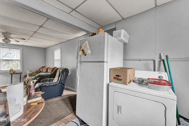 laundry area featuring carpet floors, washer / clothes dryer, and ceiling fan