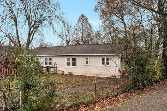 back of property with fence