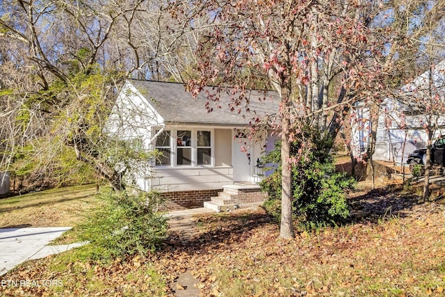 view of front of home featuring roof with shingles