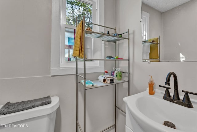 bathroom with a sink and toilet