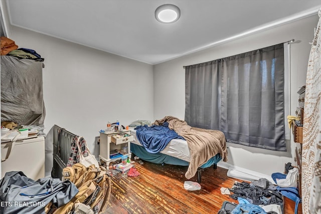 bedroom with wood finished floors