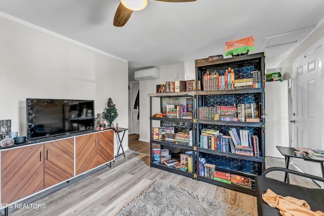 interior space featuring a wall mounted AC, ceiling fan, and wood finished floors