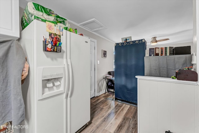 kitchen featuring wood finished floors and white refrigerator with ice dispenser