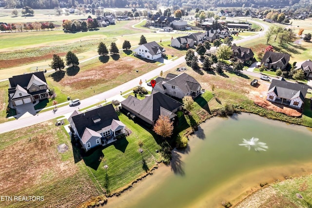 aerial view with a water view and a residential view