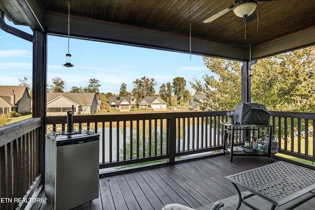 deck featuring a residential view and ceiling fan