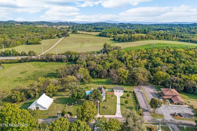 aerial view featuring a view of trees