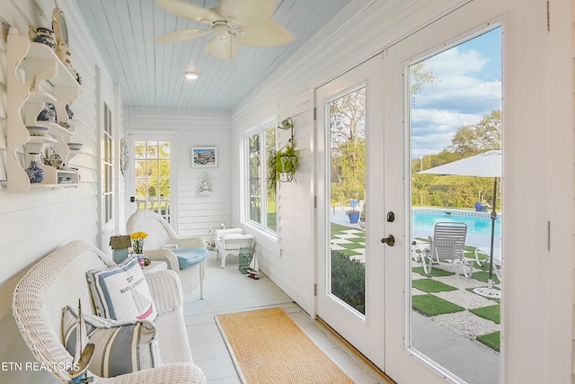 sunroom / solarium featuring wood ceiling