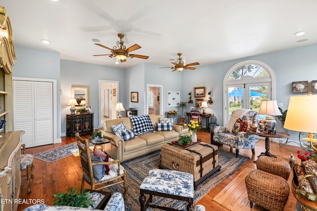 living area featuring recessed lighting, a ceiling fan, and hardwood / wood-style flooring